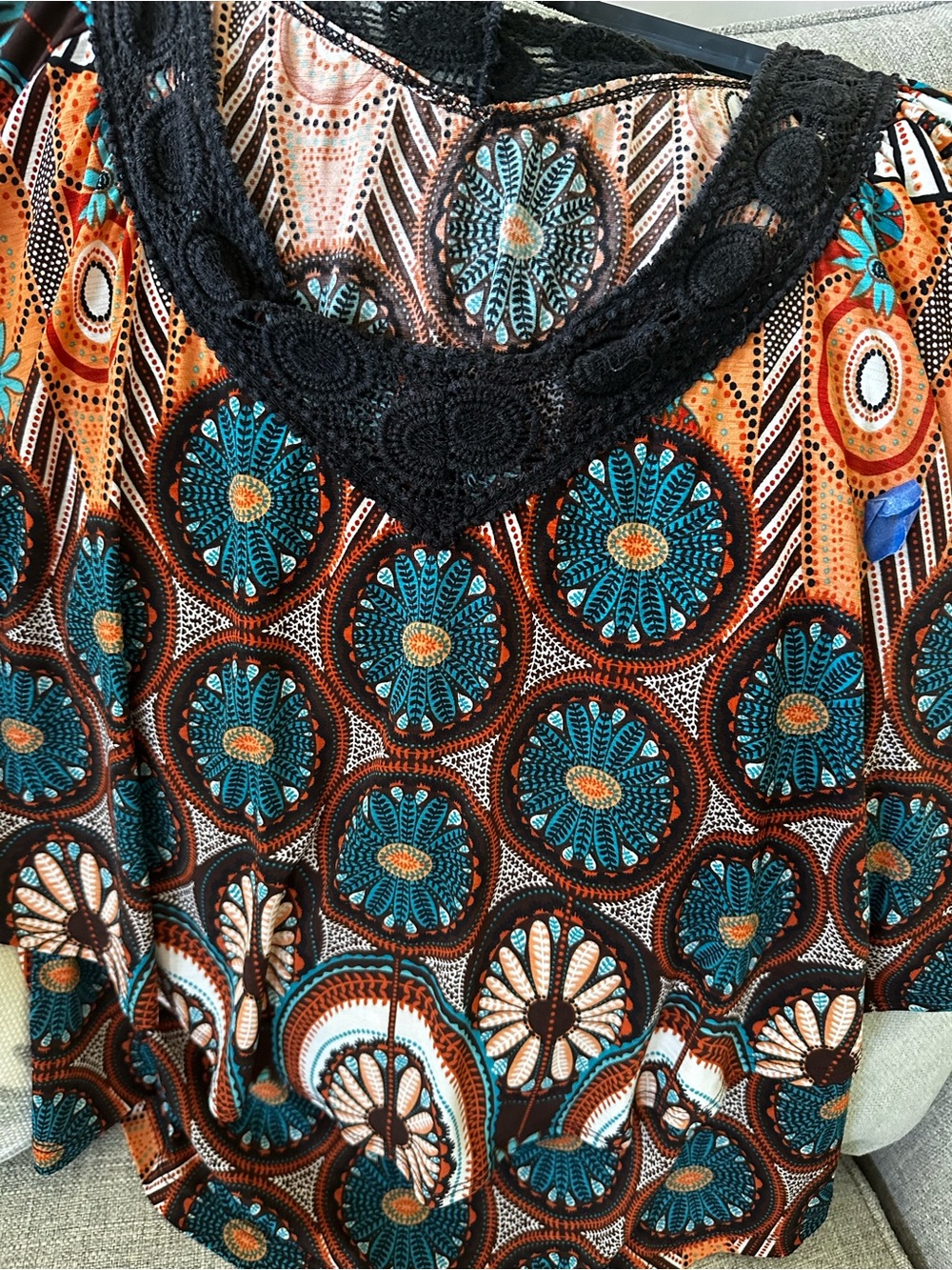 Size large boutique top. Orange, black, teal, white